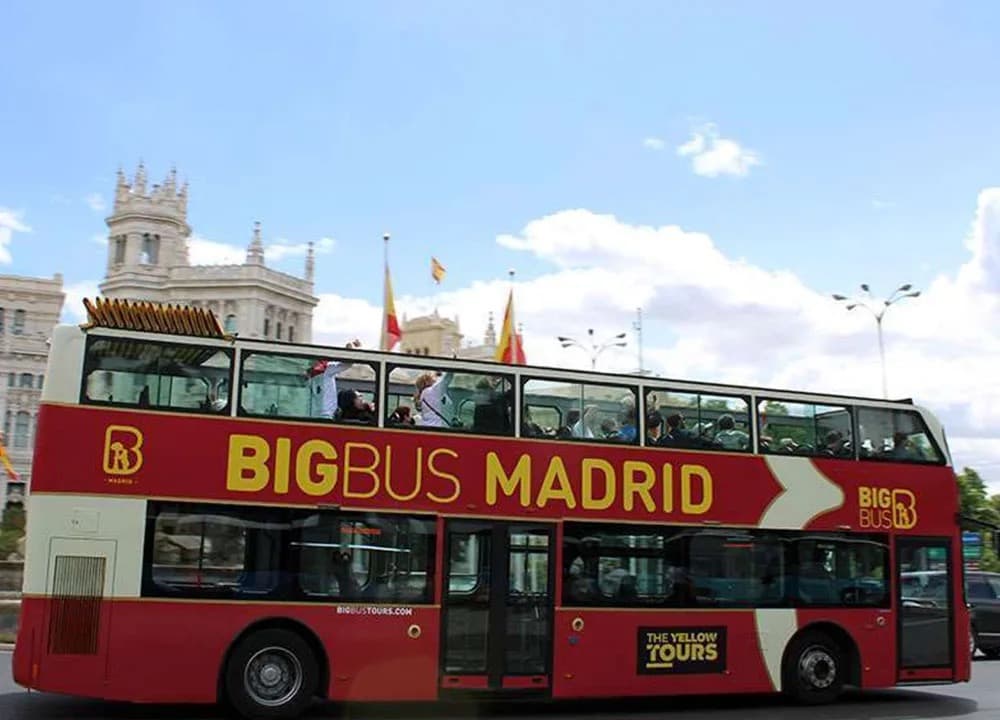 Big Bus Madrid double-decker sightseeing bus next to Cibeles Palace
